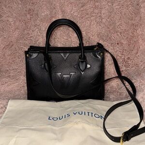 Louis Vuitton Elegant Black Tote with Gold Details
